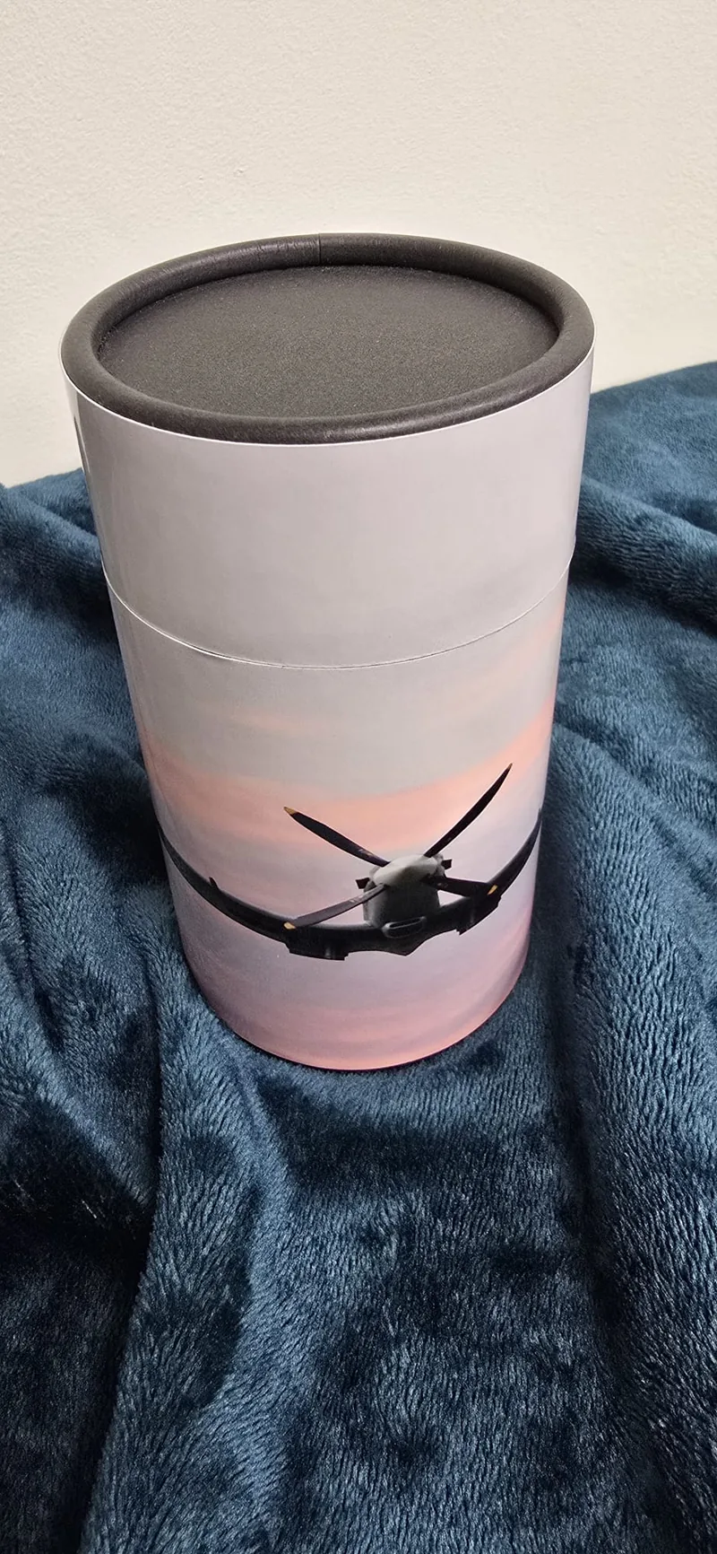 An aeroplane against a pink sky